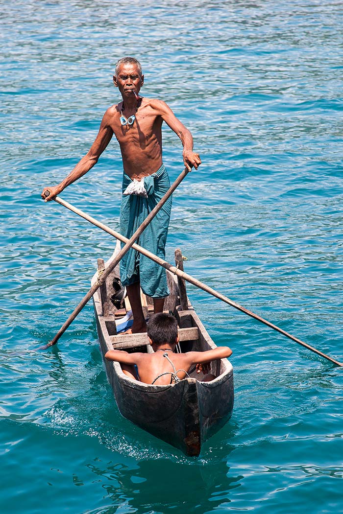 A Moken man on a traditional boat.