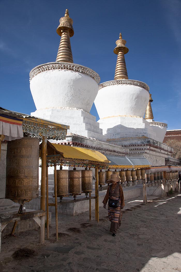 A pilgrims spinning the prayer wheels at Tashilhunpo Monastery