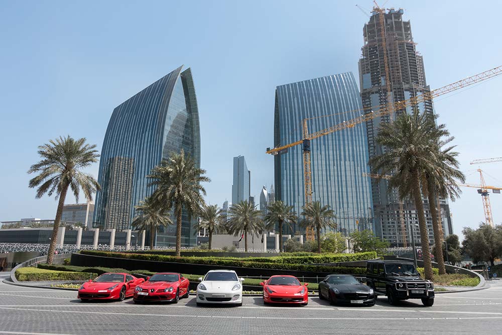 Luxury cars in front of the Burj Kalifa.