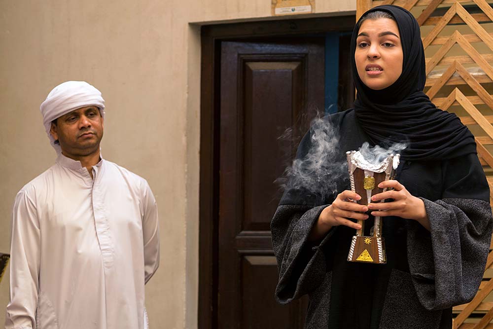 A university student discusses Emirati culture with us over breakfast.