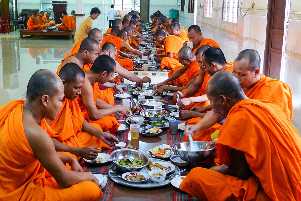 Monks eating their final meal of the day at 11am.