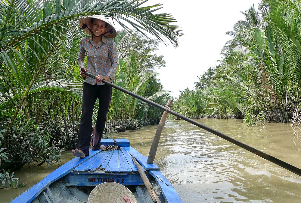 Our friendly sampan lady in rowed us through the narrow passageways of the Delta.