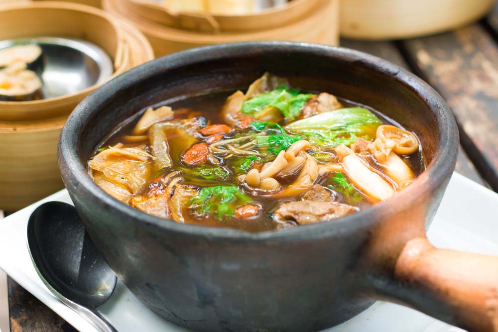 Bakuteh-a hearty broth of herbs and spices bubbling around meaty pork ribs.