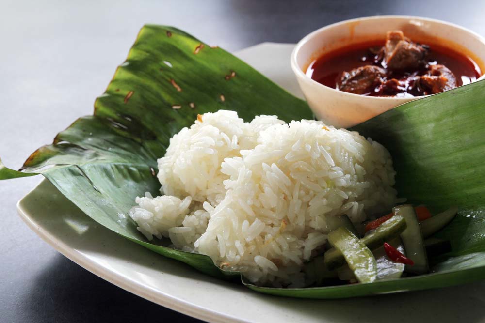 Nasi dagang, a Malaysian dish consisting of rice steamed in coconut milk and fish curry.